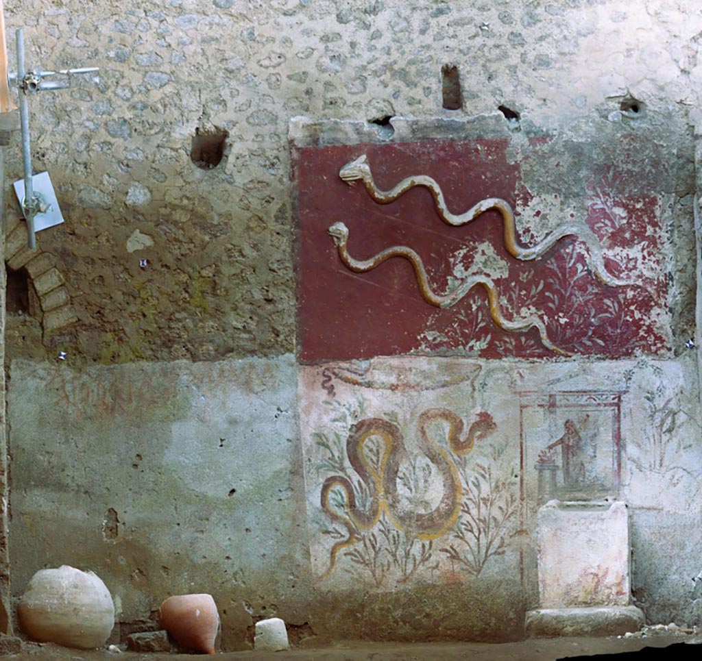 IX.10.1 Pompeii. Lararium and altar recently found in room 12. 
Photo of the south wall of the lararium (12).
The lararium is structured on two superimposed registers with an upper register decorated with stucco and a lower register decorated with frescoes.
Fotopiano della parete sud del larario (12).
La rappresentazione è strutturata su due registri sovrapposti con un registro superiore decorato a stucco ed uno inferiore decorato ad affresco.
See PAP e-journal 6, 28.09.2023, p. 64, fig. 10. Download: PAP e-journals 2023 collection volumes 01-09 
Photograph © Parco Archeologico di Pompei.

