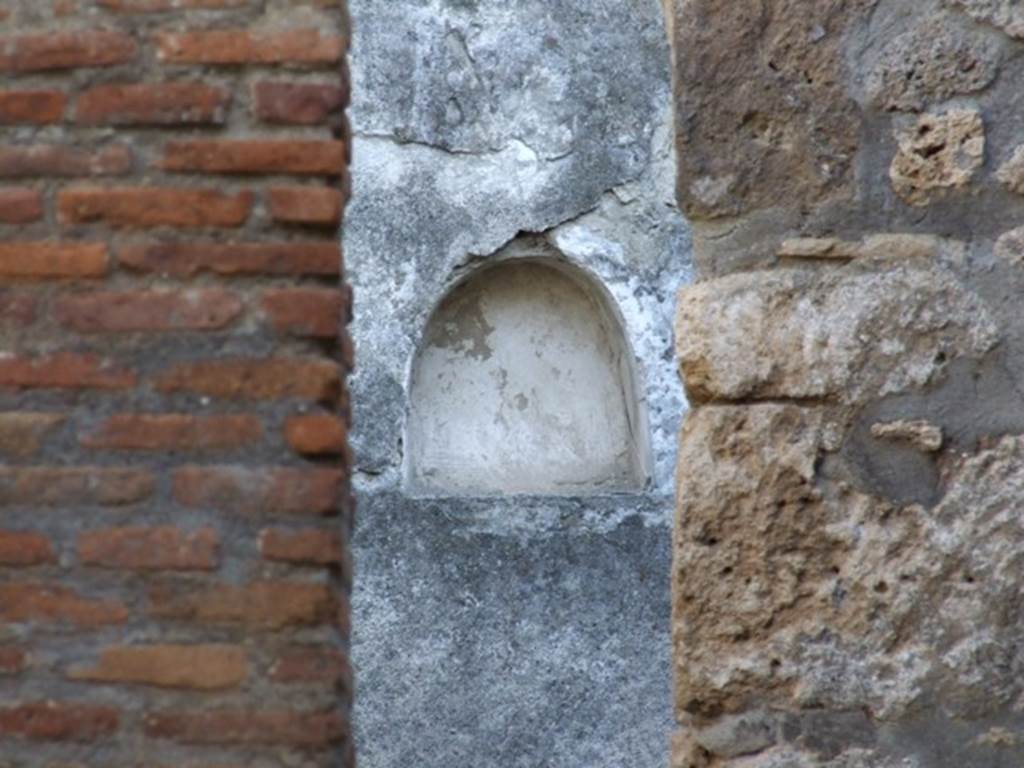 I.11.3 Pompeii.  December   2007.  Niche on south wall of the garden viewed through kitchen doorway.
