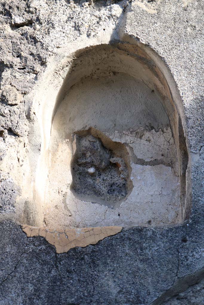 VII.4.49 Pompeii. December 2018. 
East wall with niche (h.0.48, w.0.40, d.0.20, h. above floor 1.90) set above the stairs. 
Photo courtesy of Aude Durand.
According to Boyce, its inside was coated with white stucco. 
It was called by Fiorelli la nicchia de’ Penati.
See Boyce G. K., 1937. Corpus of the Lararia of Pompeii. Rome: MAAR 14. (p. 66, no. 276). 

