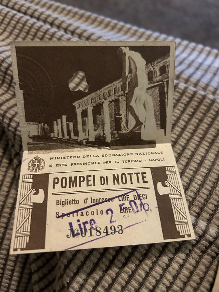 T.14A. Pompeii di Notte ticket 018493. Entry fee was 2.50 Lire, overriding the 10 Lire printed on the ticket.
Photo courtesy of Alyson Jean Hodge.
According to a press report of April 1939, and photo entitled “Electricity comes to Pompeii”, a new 150,000 candle power lighting system was under test. It was due to go into operation a week later. Information and photo courtesy of Rick Bauer.
This ticket therefore dates from after April 1939. A similar ticket number 048199 from 1944 can be compared below.

 

