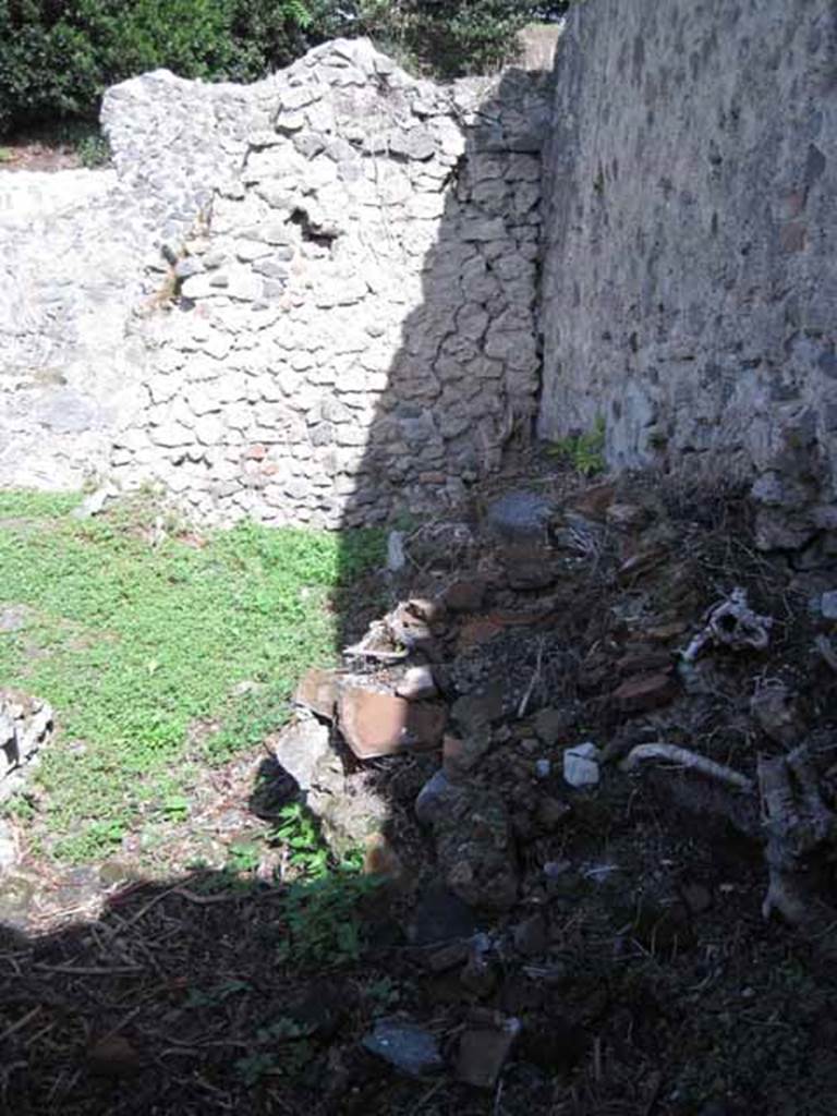 I.2.24 Pompeii. September 2010. Looking east into the room, kitchen and latrine, in the south-east corner of the peristyle. Photo courtesy of Drew Baker.

