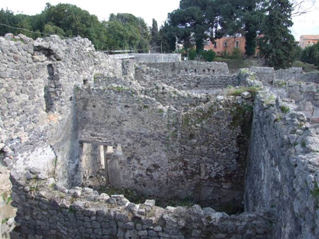 I.2.24 Pompeii.  March 2009.  South wall of dormitory with recess. Taken from I.2.20. Looking south.