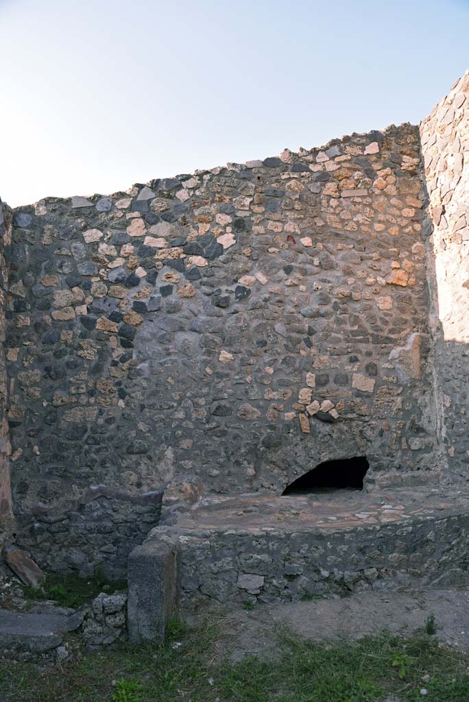 I.4.25/I.4.5 Pompeii. October 2019. 
Kitchen 42, looking towards hearth against north wall, with latrine, on left.
Foto Tobias Busen, ERC Grant 681269 DCOR.
