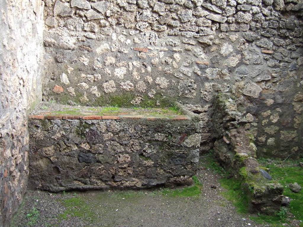 I.6.4 Pompeii. December 2005. Room 8, hearth or bench in kitchen.