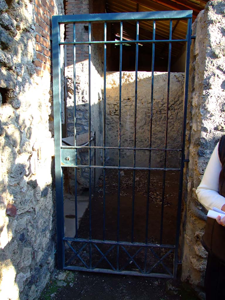 I.6.4 Pompeii. March 2009. Doorway to room 12, with room 11 on the east side.