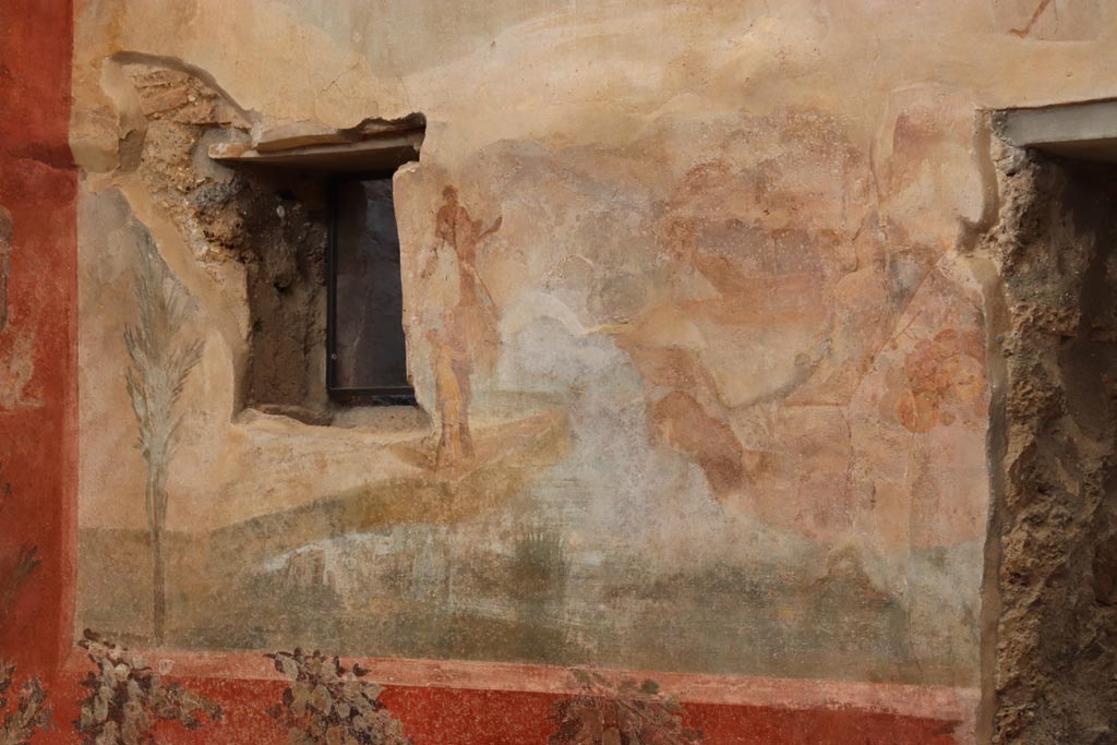 I.6.15 Pompeii. October 2023. Room 9, painted east wall between two windows. Photo courtesy of Klaus Heese.