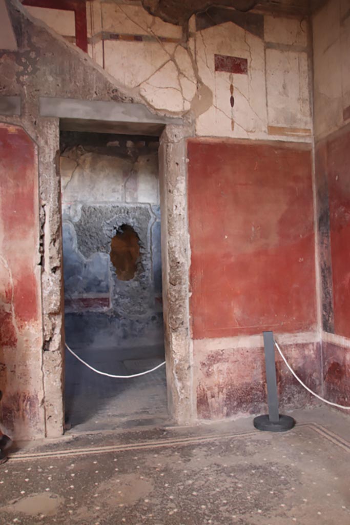 I.6.15 Pompeii. October 2023.
Room 12, triclinium, looking north through doorway in north-east corner of atrium. 
Photo courtesy of Klaus Heese.
