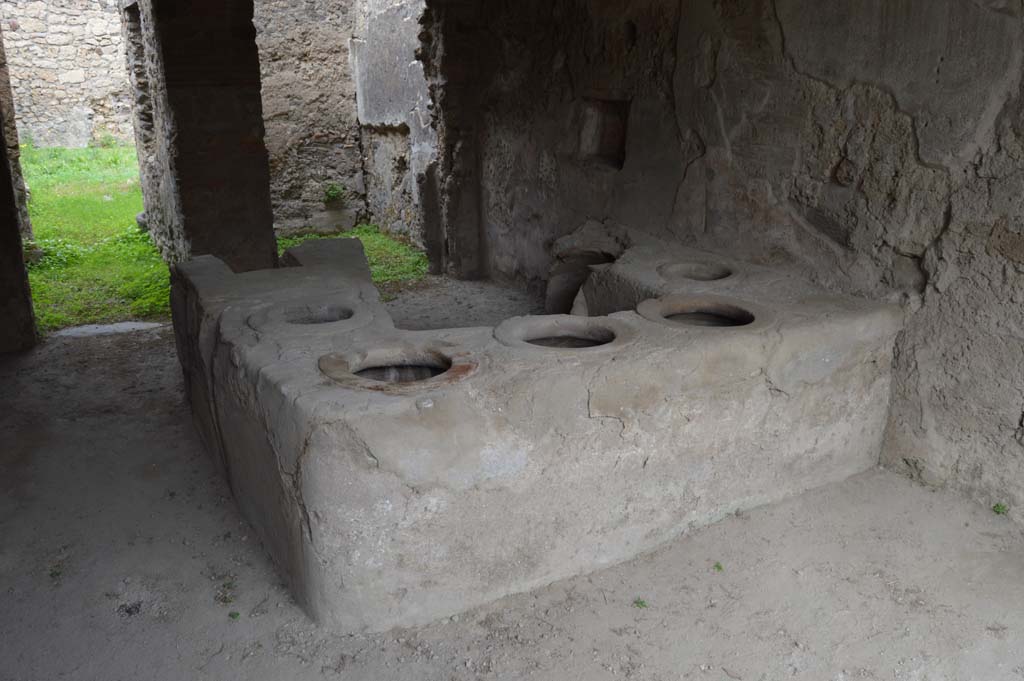 I.8.15 Pompeii. October 2017. Looking towards podium in bar room, and doorways to two rear rooms on its north side.
Foto Taylor Lauritsen, ERC Grant 681269 DÉCOR.
