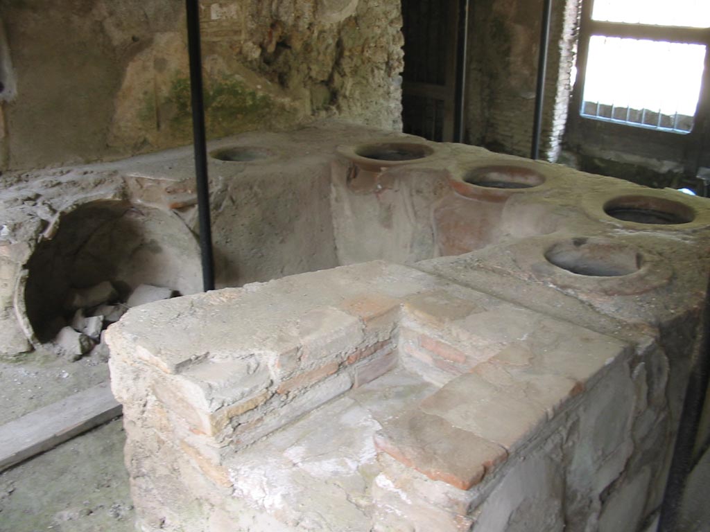 I.8.15 Pompeii. May 2003. Looking south-east across rear of shop-counter. Photo courtesy of Nicolas Monteix.