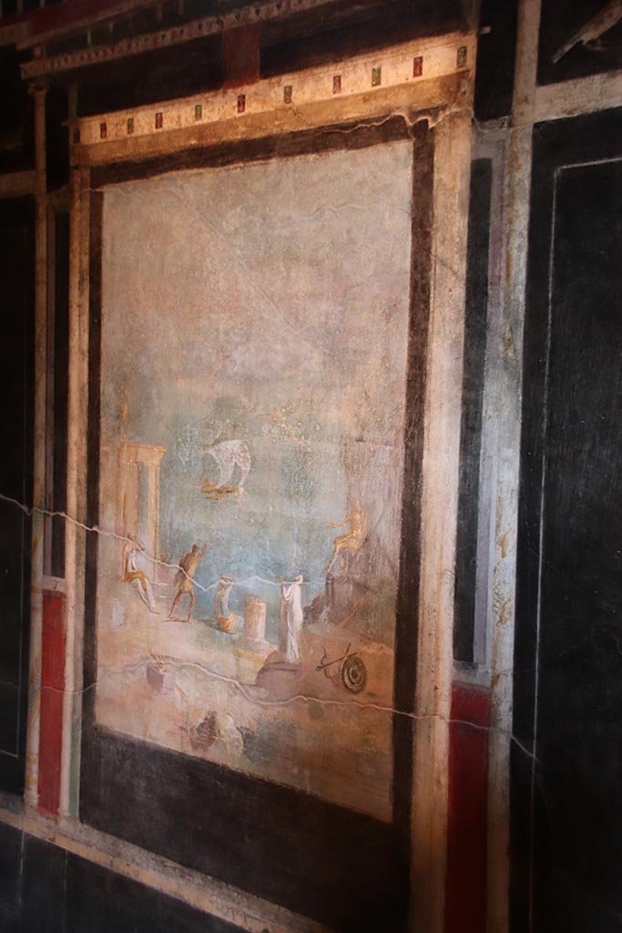 I.9.5 Pompeii. October 2024. 
Room 10, central painting of Daedalus and Icarus, from east wall. Photo courtesy of Klaus Heese.
