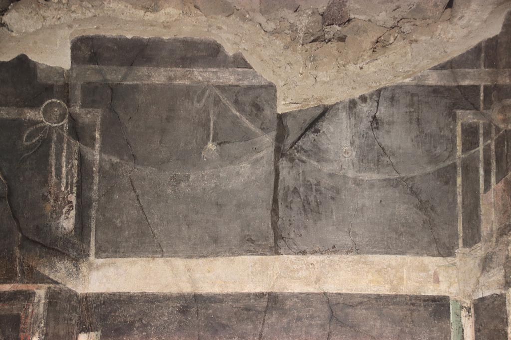 I.9.5 Pompeii. October 2024. Room 10, upper north wall, detail from above central painting. Photo courtesy of Klaus Heese