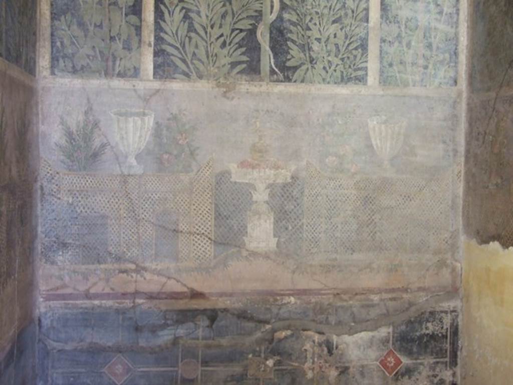 I.9.5 Pompeii. March 2009. Room 11.Cubiculum. East wall.  Garden painting with lattice fencing, white vases and table with Isis jug or jar.