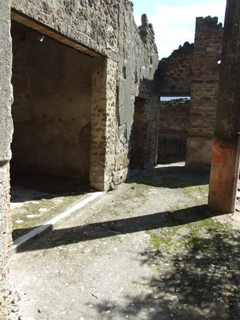 I.9.5 Pompeii. March 2009. East side of portico, with large doorway to room 13.