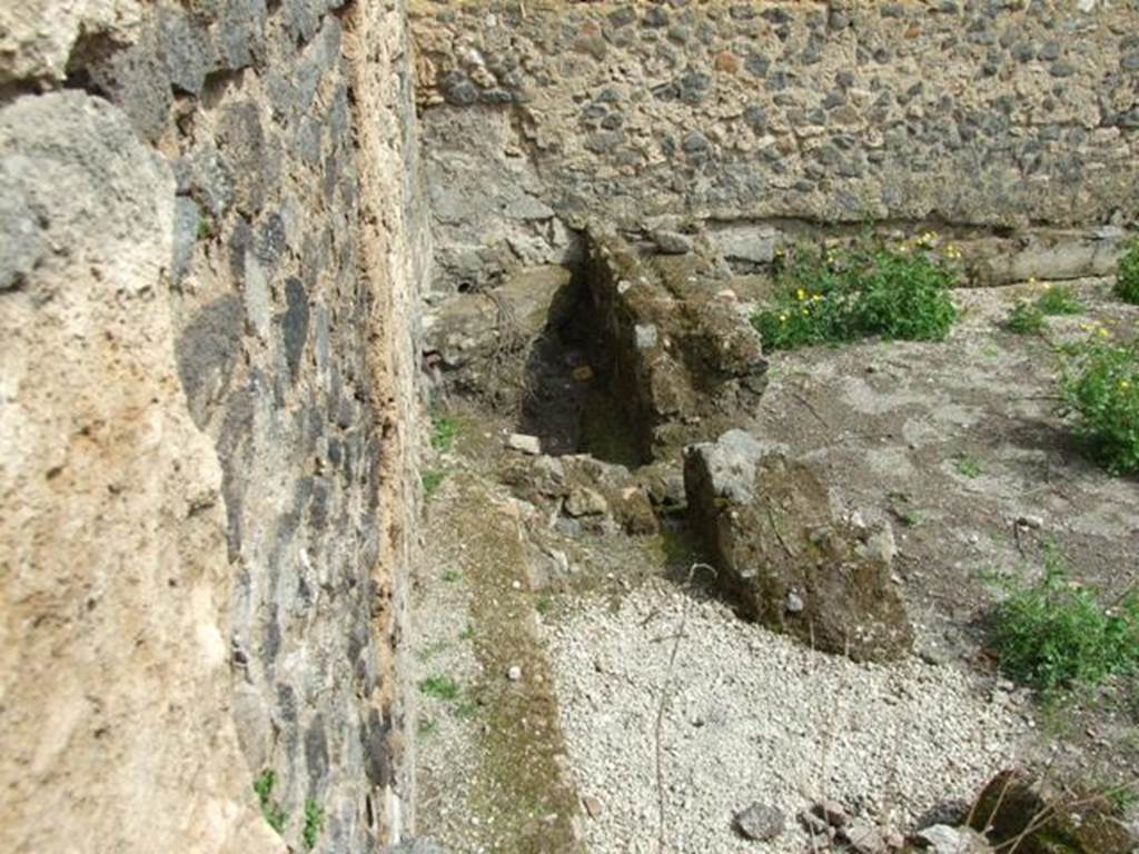 I.9.11 Pompeii.  March 2009.  North east corner of yard area, with remains of  brick walls.