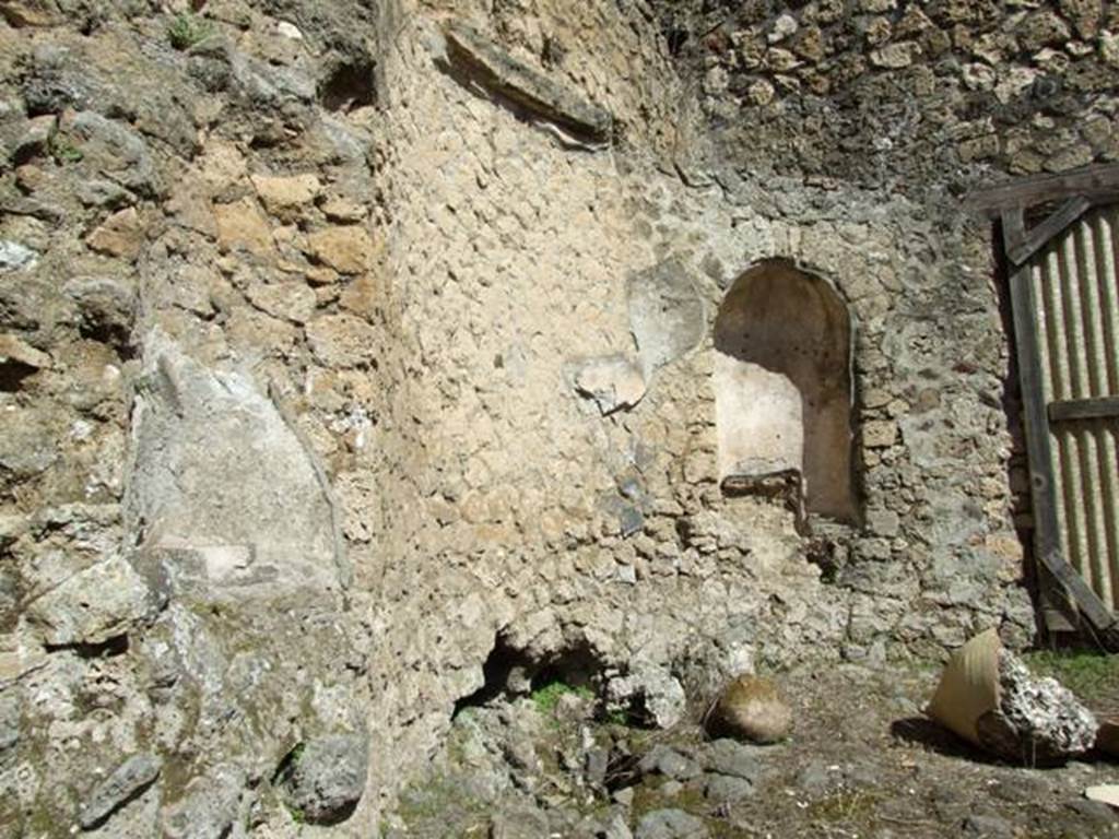 I.10.4 Pompeii. March 2009. Room 49 with remaining niche in north-east corner, and part of another niche, on the left. According to Jashemski, Maiuri identified this as a heliocaminus (an area exposed to the sun, used as a winter abode). See Jashemski, W. F., 1993. The Gardens of Pompeii, Volume II: Appendices. New York: Caratzas. (p.47; Fig 54 ).