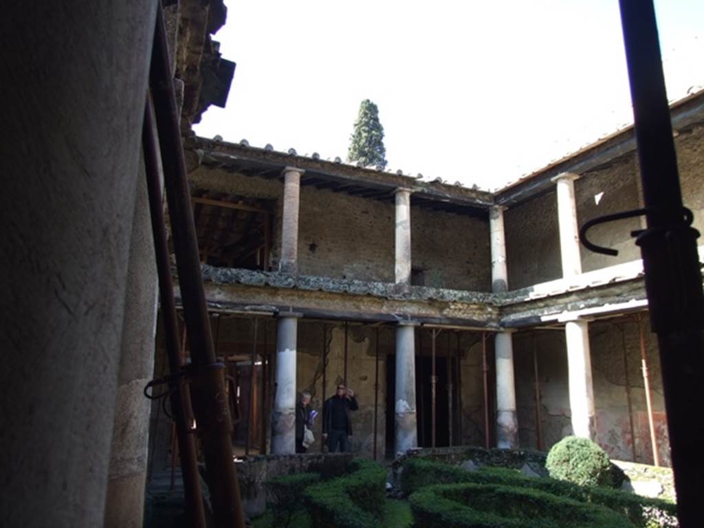 I.10.11 Pompeii. March 2009. Room 10, looking north-west across peristyle garden at lower and upper floors.