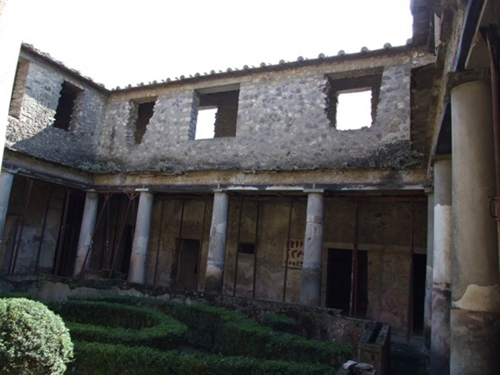 I.10.11 Pompeii. March 2009. Room 10, looking south across garden peristyle and upper floor.