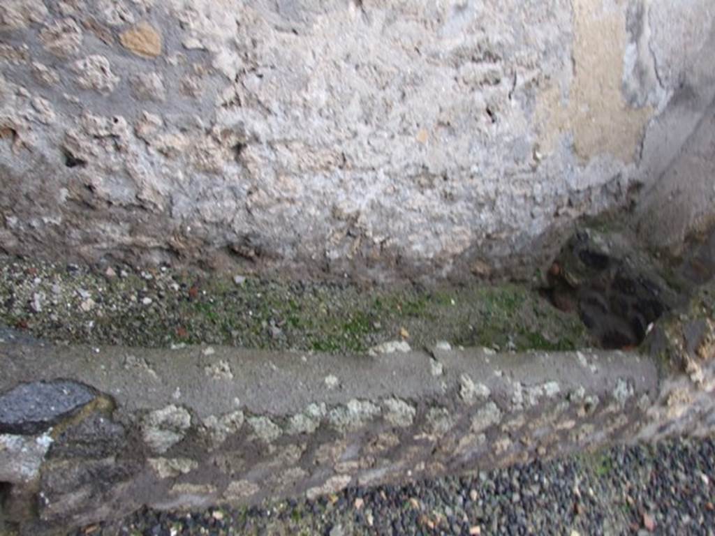 I.11.15 Pompeii. December 2007. Room 2,  storeroom with latrine on north side of entrance. Originally this room would have had a doorway into the atrium, the join in the wall can be seen towards the right. 
