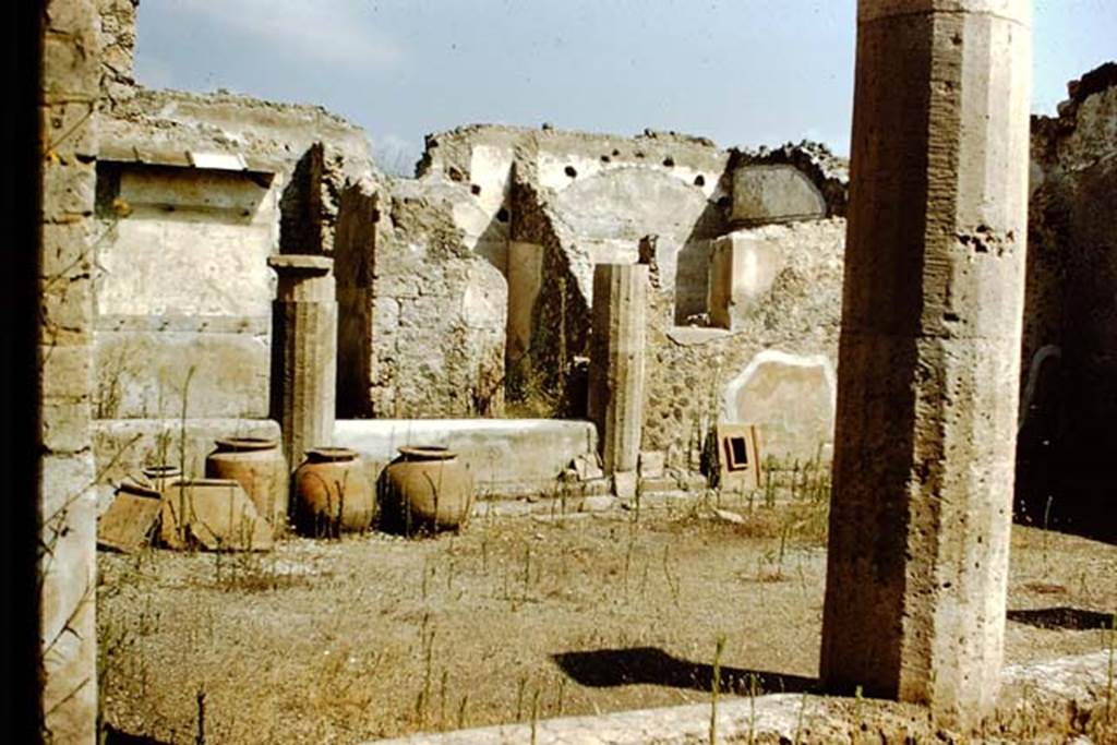 I.15.3 Pompeii. October 2022. 
Looking east along south wall of south portico 10, towards doorway into room 14, garden area. Photo courtesy of Klaus Heese.
