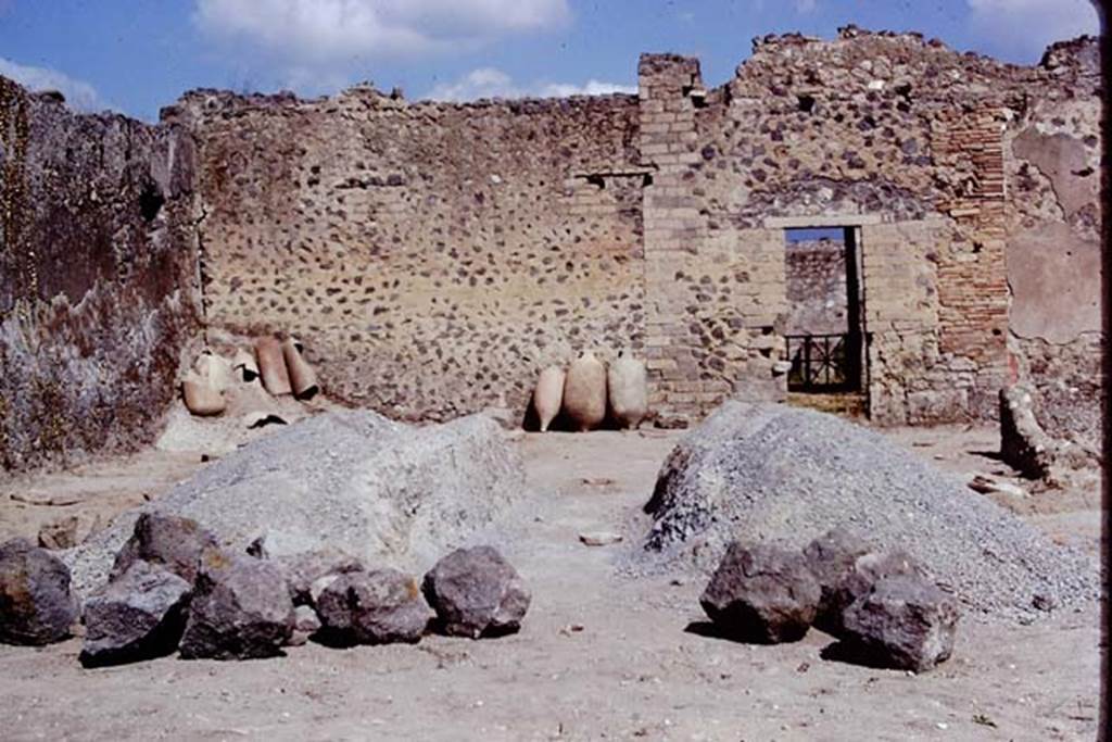 I.15.3 Pompeii. 1972. North-west corner of garden 14 with doorway to portico 10. Photo by Stanley A. Jashemski. 
Source: The Wilhelmina and Stanley A. Jashemski archive in the University of Maryland Library, Special Collections (See collection page) and made available under the Creative Commons Attribution-Non Commercial License v.4. See Licence and use details.
J72f0681

