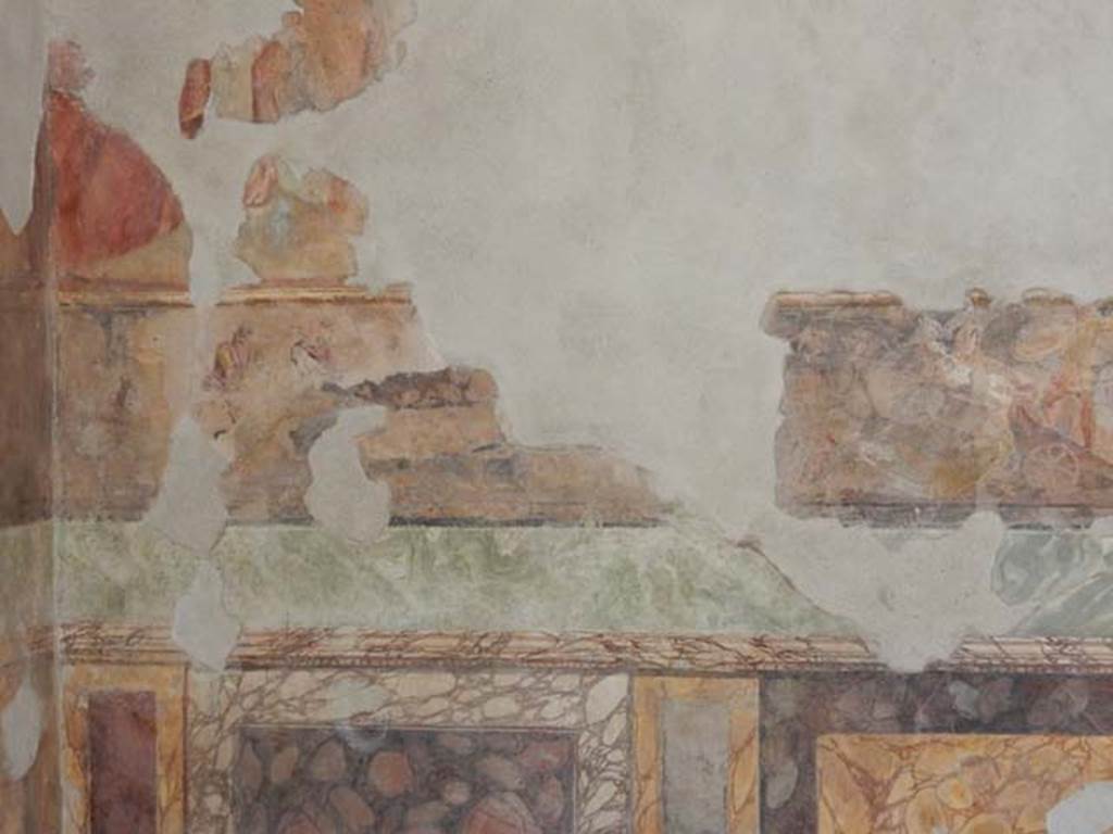 II.2.2 Pompeii. May 2016. Room “h”, west end of north wall. 
Iliad frieze, possibly the Body of Sarpedon, above the marbled zoccolo. 
Photo courtesy of Buzz Ferebee.


