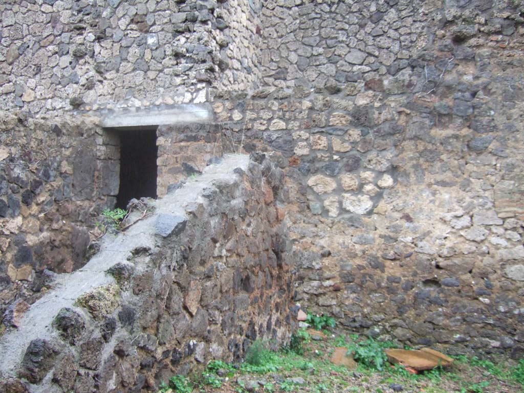 II.4.12 Pompeii. December 2006. Looking east, to north of entrance doorway.