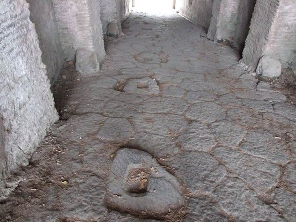 II.6 Pompeii. December 2006. Amphitheatre showing holes into which stakes carrying barriers were fitted as a means of dividing the corridor when necessary
