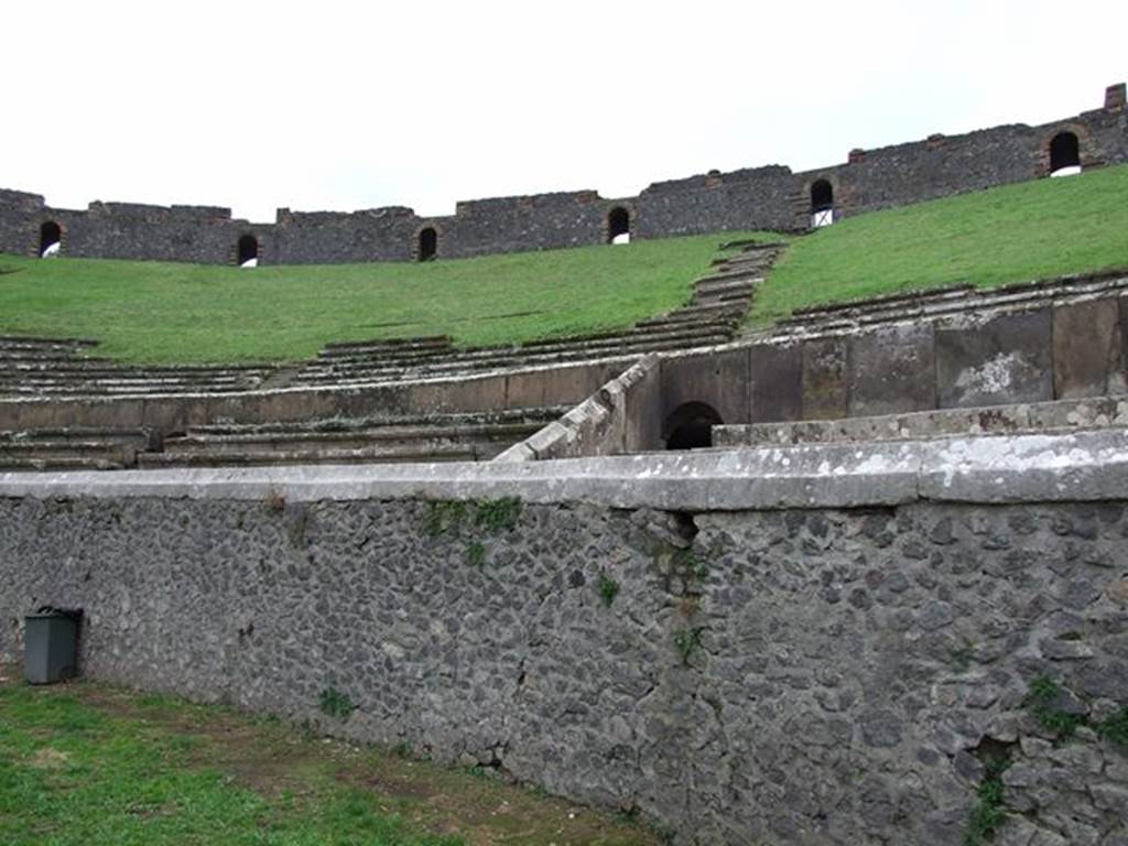 II.6 Pompeii. December 2006. Arena wall and seating of Amphitheatre, looking south-west.