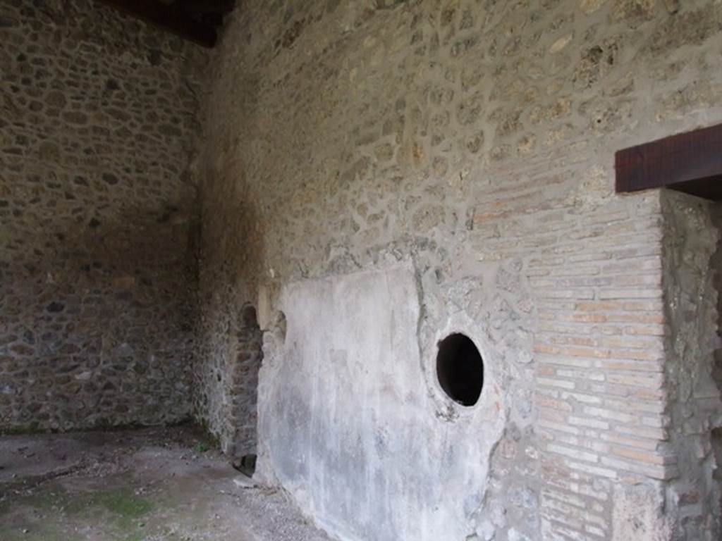 III.2.1 Pompeii.  March 2009.  South east corner of portico, with door to Room 12. Baths area.