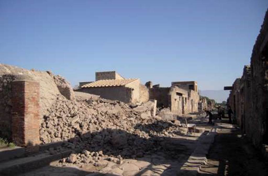 III.3.5 and 6 Pompeii. November 2010.  Looking east along Via dellAbbondanza, from near III.3.4 (pilaster on left).
