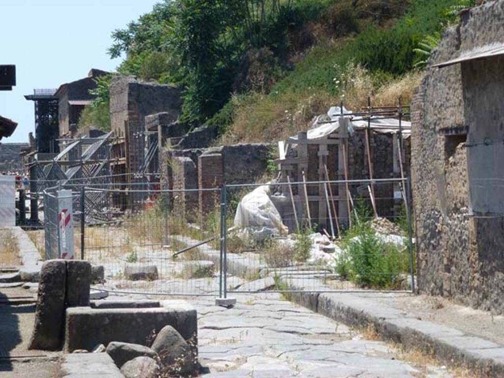 III.4.1 Pompeii, on right. June 2012. Looking west along Via dellAbbondanza with site of III.4.1 on its north side, on the right. Photo courtesy of Michael Binns.
