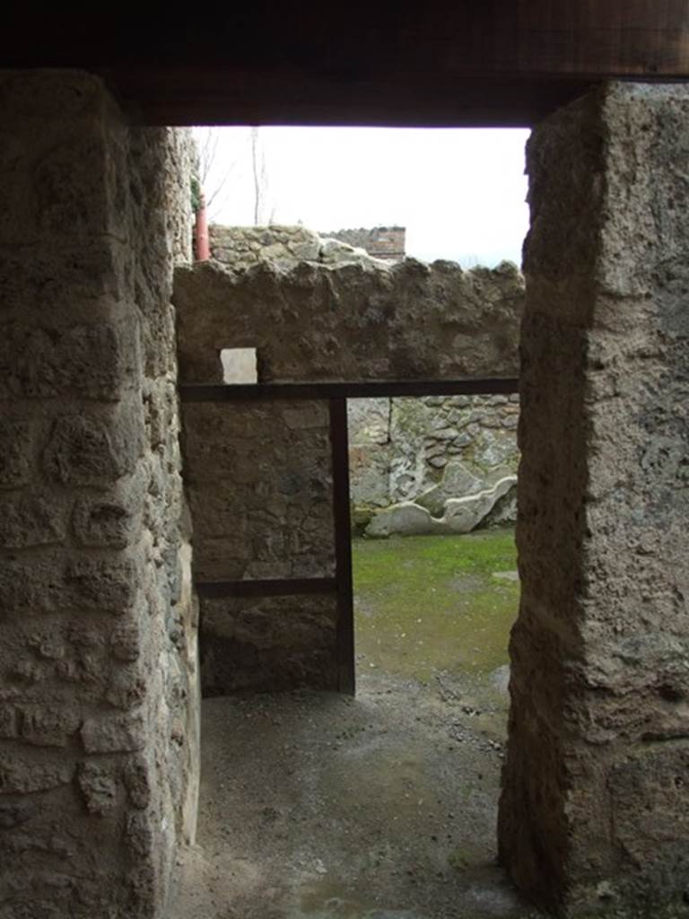 III.4.3  Pompeii.  March 2009.   Room 12.  Courtyard.  Looking south to doorway to room 23.