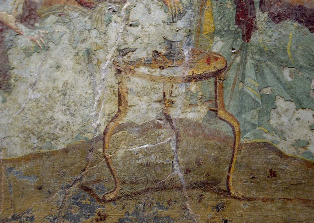 V.2.4 Pompeii. June 2017. 
Room 15, detail of a table from the banqueting scene on the north wall of the triclinium. Photo courtesy of Johannes Eber.

