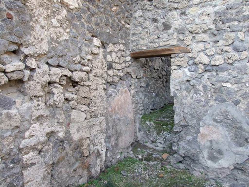 V.2.17 Pompeii. December 2007. North-west corner of middle room, with doorway to rear room.