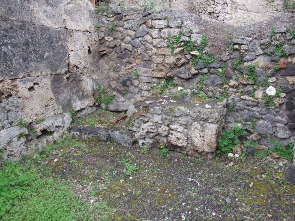 V.3.3 Pompeii. May 2010. Base of steps to upper floor in north-west corner of shop. 