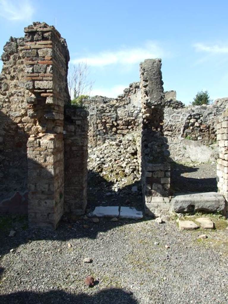 V.3.9 Pompeii. March 2009. North wall of atrium. Doorway to triclinium D, and steps to upper floor.