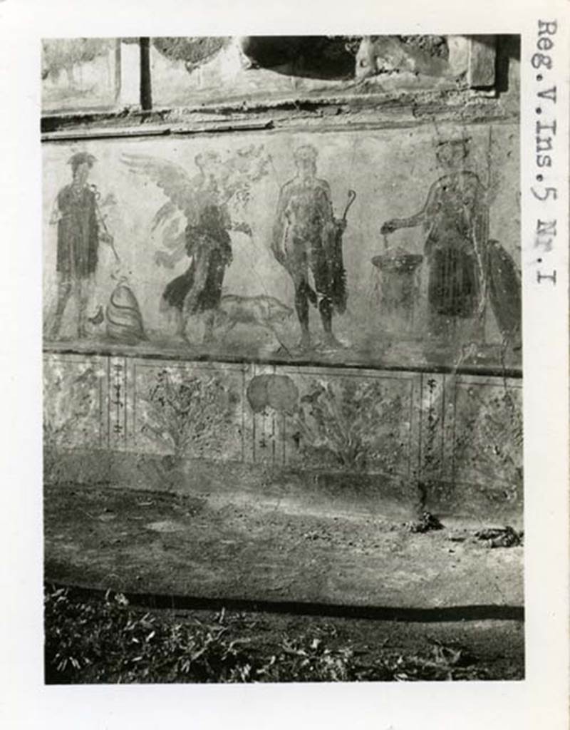 V.4.3 Pompeii, but shown as V.5.1 on photo. 1937-39. Lower part of lararium painting from west wall of atrium. Mercury, Victoria, Hercules and Minerva. Photo courtesy of American Academy in Rome, Photographic Archive. Warsher collection no. 1568a.

