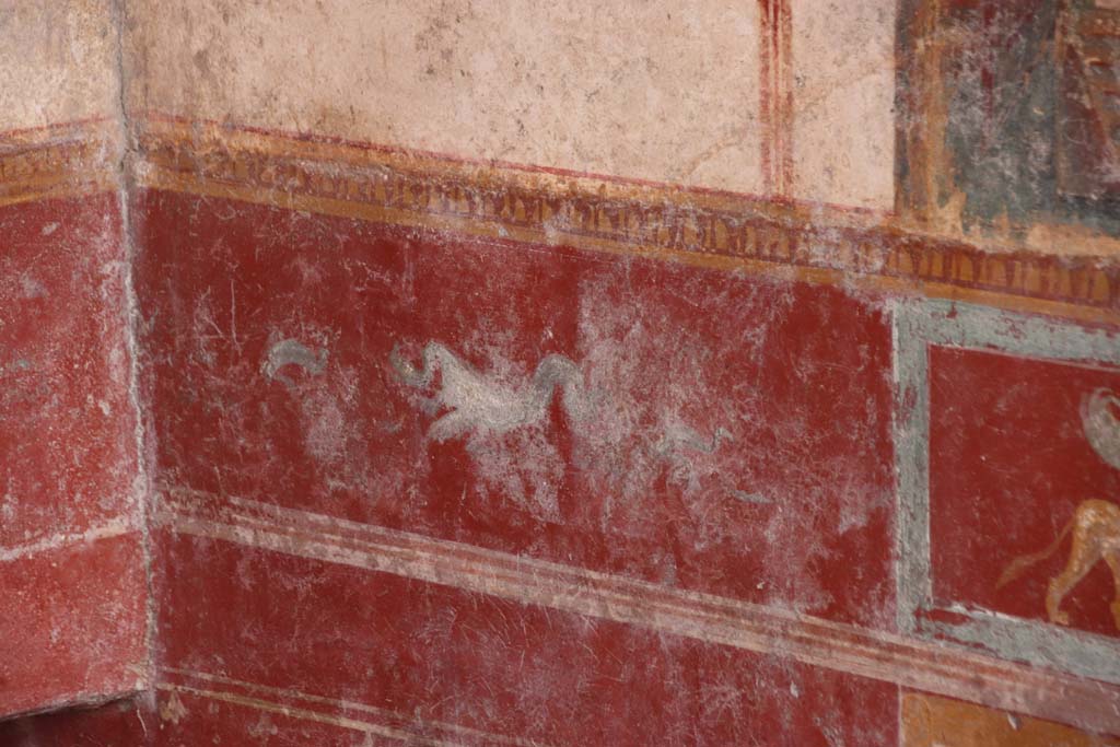 V.6.12 Pompeii. October 2020. Amb. 9. Painted dolphin and sea creature in zoccolo/dado at east end of south wall. Photo courtesy of Klaus Heese 