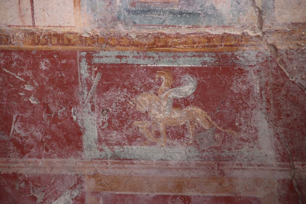 V.6.12 Pompeii. October 2020. Amb. 9. Painted griffin with cornucopia in zoccolo/dado at west end of south wall. Photo courtesy of Klaus Heese.