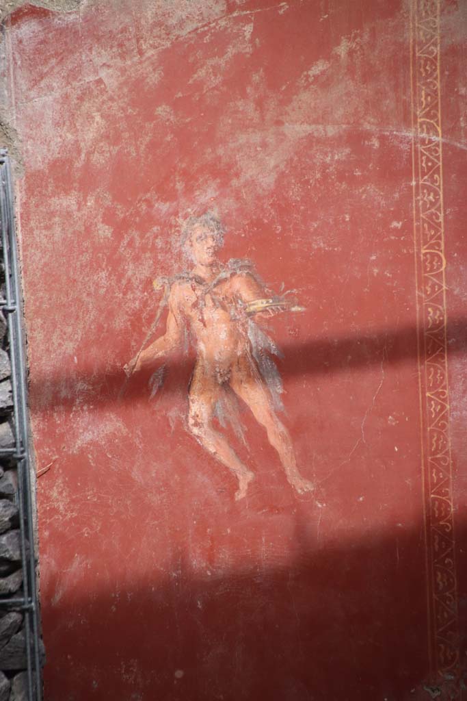 V.6.12 Pompeii. October 2020. Amb. 25. Atrium, red panel with flying figure.  Photo courtesy of Klaus Heese.