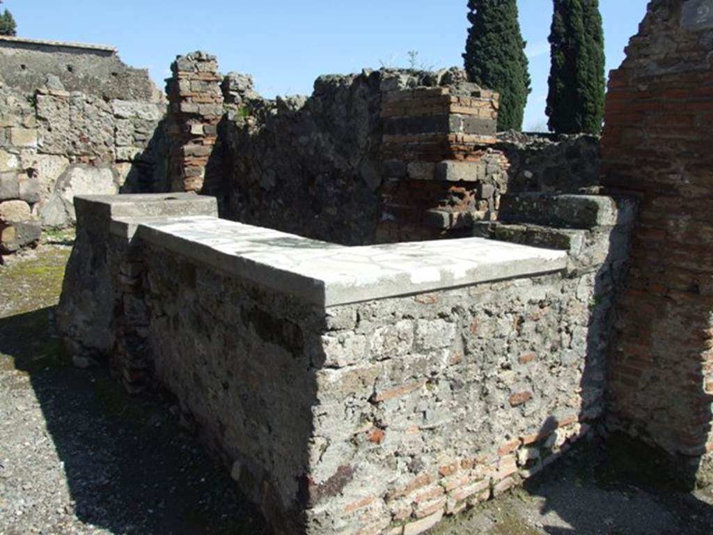 VI.1.2 Pompeii. March 2009. Counter, looking south-east.
According to Parslow, this counter originally had decorative heads built into its street facade.
Even as far back as 1794, thieves successfully extracted one of the two sculpted heads immured in the counter of this bar/shop.
See Parslow, C., (2001) .The Open Air Excavations at Pompeii in the Eighteenth Century: New Methods, New Problems.
In Pompei, Scienza e Societa, ed by P.G. Guzzo. Milan, Electa, p. 19-28. 
See PAH I, 2, 54: 20th February 1794.
