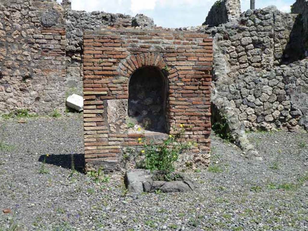 VI.3.10 Pompeii. May 2010. Lararium on east side of workshop.