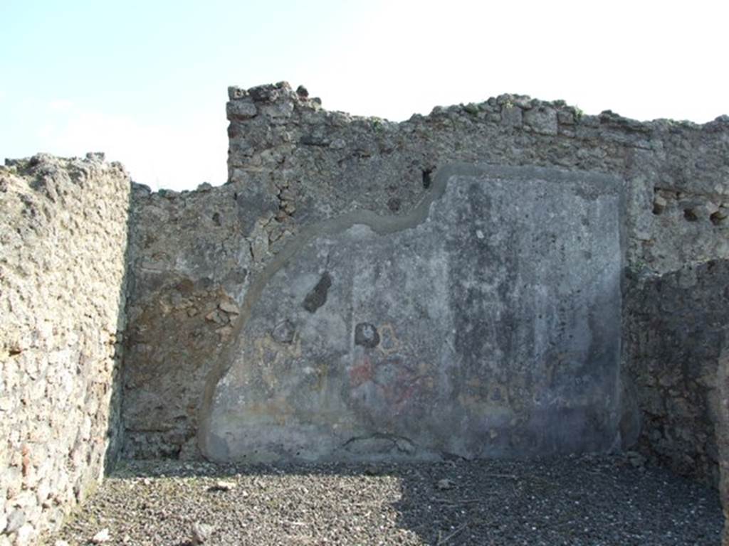 VI.7.3 Pompeii. March 2009. Room 9, south wall of oecus. 
According to PPM 
– the zoccolo was discoloured: the middle zone of the wall had a red central panel with yellow side panels, which may have been separated by candelabra (?). According to Mau, the wall was III Style.
See Carratelli, G. P., 1990-2003. Pompei: Pitture e Mosaici 4. Roma: Istituto della enciclopedia italiana, (p.367)

