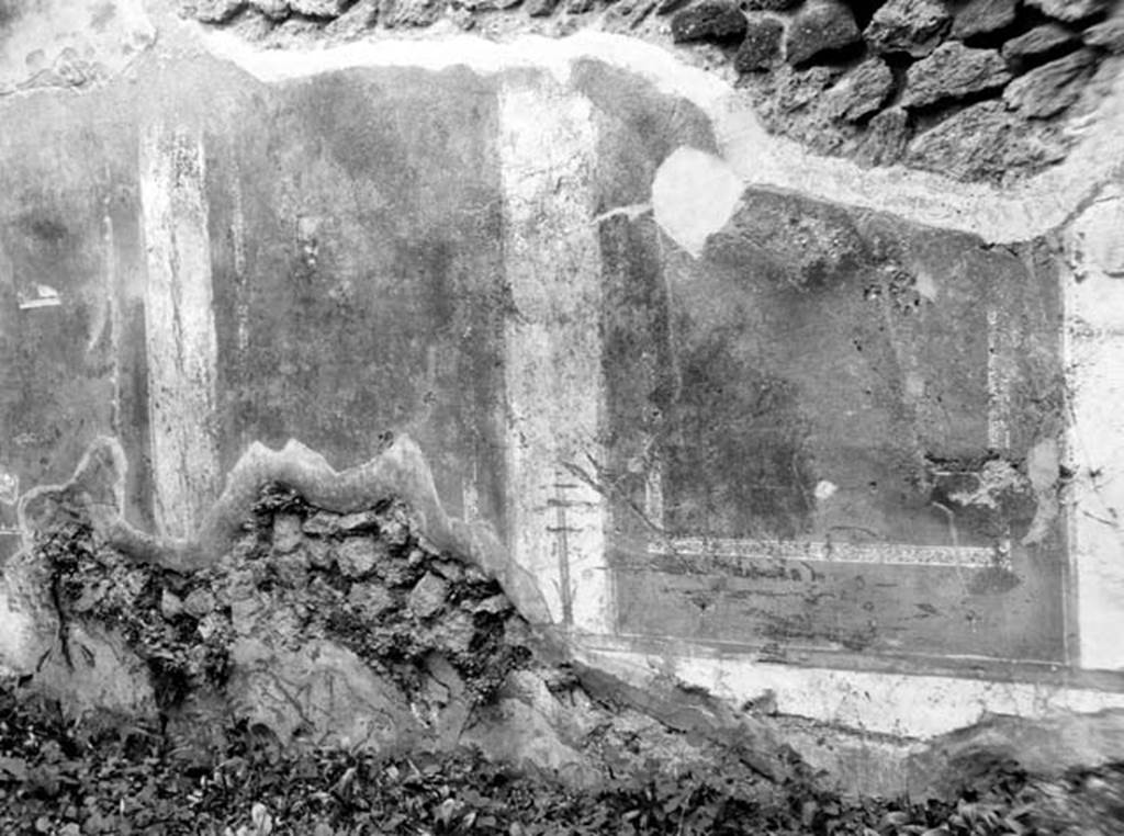 VI.7.16 Pompeii. W.1313. Ambiente 13, west wall with remains of wall decoration.
According to Bragantini, the west wall was described as having yellow panels with a vignette of a bird in both its north and south panel.
It was bordered with two parallel lines, and separated by narrow white panels, with golden candelabra. 
See Bragantini, de Vos, Badoni, 1983. Pitture e Pavimenti di Pompei, Parte 2. Rome: ICCD. (p.149, 607161303).
Photo by Tatiana Warscher. Photo © Deutsches Archäologisches Institut, Abteilung Rom, Arkiv. Listed as being from VI.7.15.

