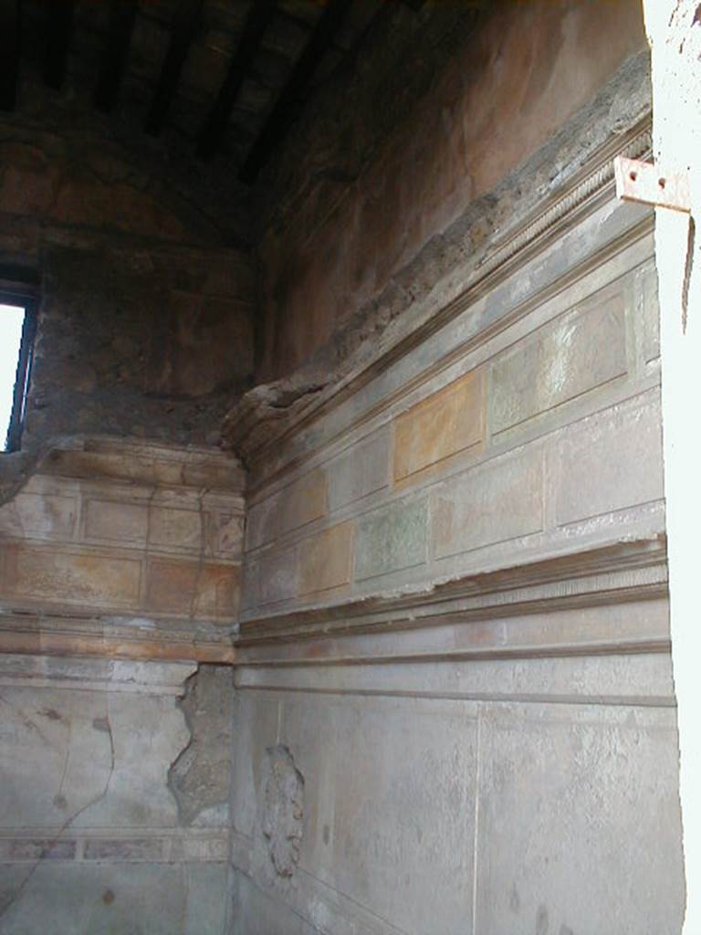 VI.9.3 Pompeii. September 2004. Cubiculum3, on south side of entrance doorway. Looking towards the north-west corner. On the left of the picture can be seen a modern window. According to Mau, originally there would have been two small windows in the west wall. The one on this side of the room has been bricked up and replaced by the modern bigger one in the centre of the wall. See Mau, A., 1907, translated by Kelsey, F. W., Pompeii: Its Life and Art. New York: Macmillan. (p. 261-2, and Fig.122)
