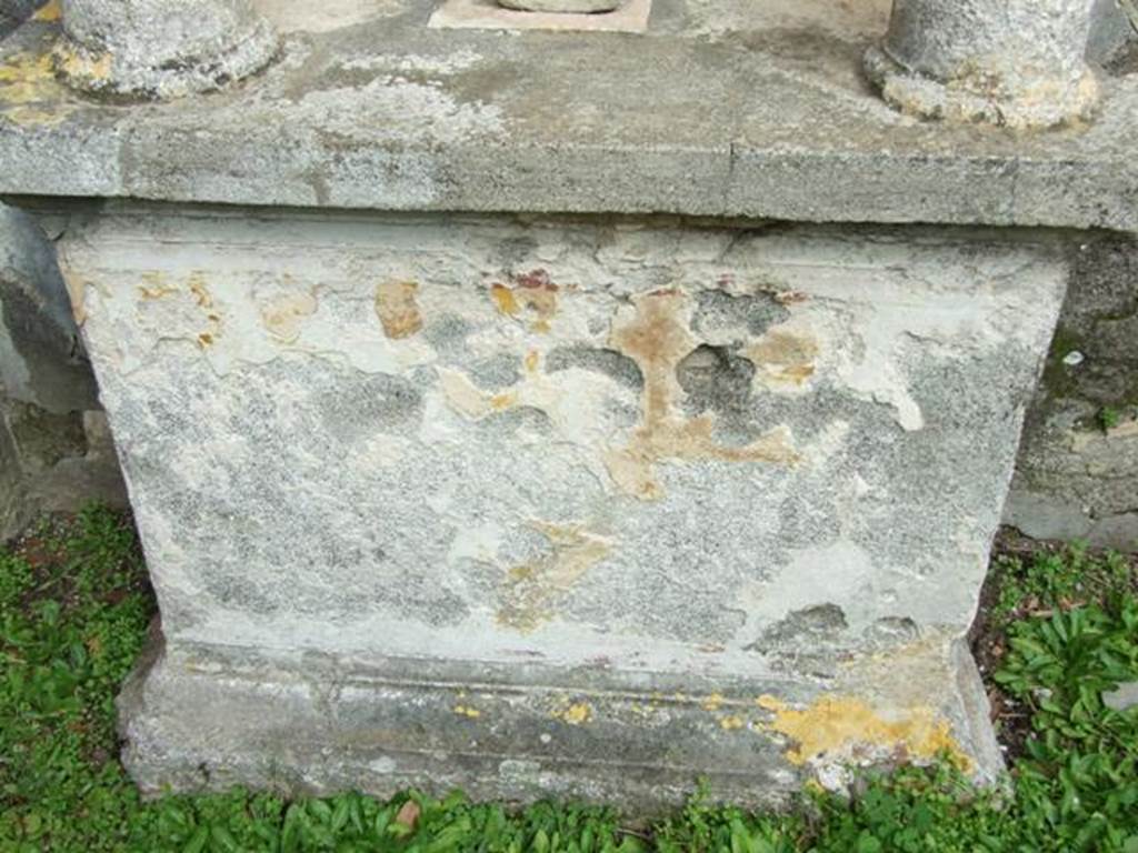 VI.9.6 Pompeii. March 2009. Room 17, remains of painted base of aedicula lararium against east wall of garden area. According to Boyce, this was a painting of a panther, raising its head towards a garland of grapes which continued onto the two adjacent sides of the base. See Boyce G. K., 1937. Corpus of the Lararia of Pompeii. Rome: MAAR 14. (p.50, 176A)


