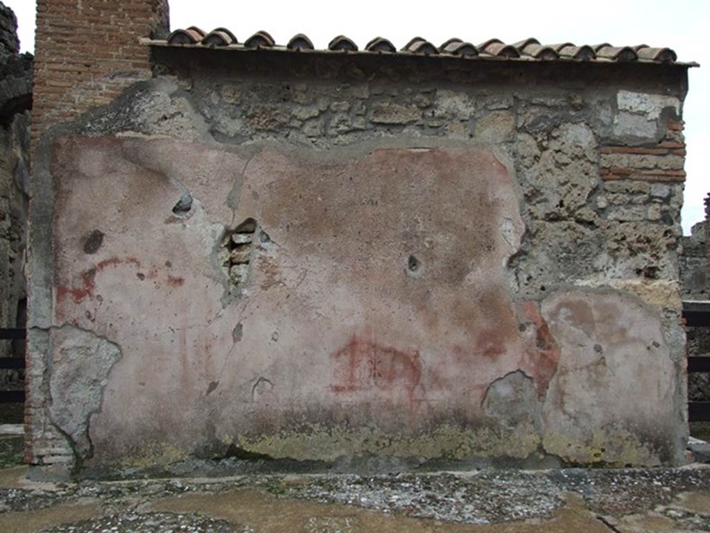 VI.10.2 Pompeii. December 2006. Plaster to right of entrance, on south side.