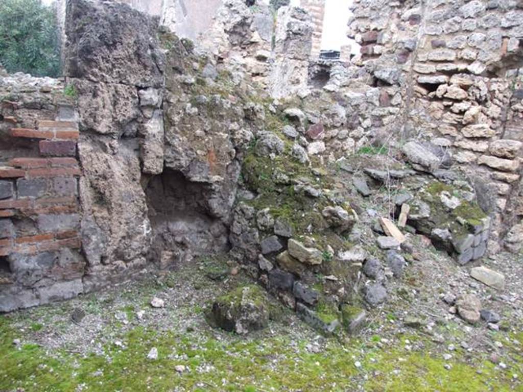 VI.10.11 Pompeii. March 2009. Room 13, kitchen bench against north wall, both in state of collapse.  