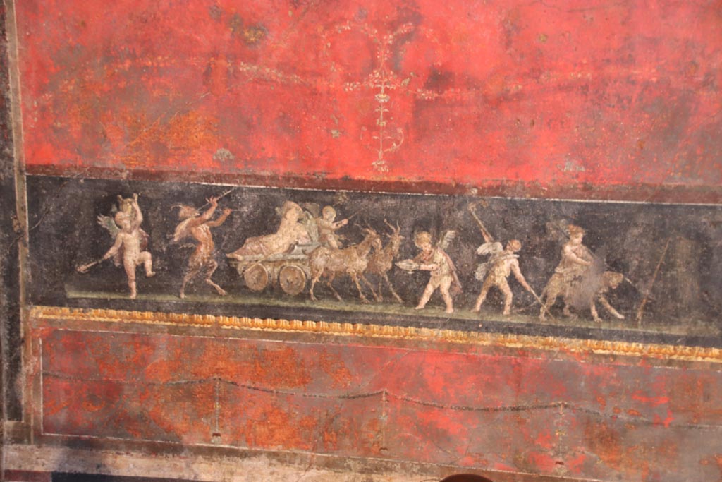 VI.15.1 Pompeii. October 2023. 
North wall in north-west corner with painting of cupids celebrating a festival in honour of Bacchus. Photo courtesy of Klaus Heese.
