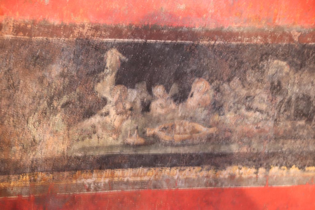 VI.15.1 Pompeii. October 2023. Detail from north wall, at east end, cupids celebrating the festival of Vesta.  Photo courtesy of Klaus Heese.